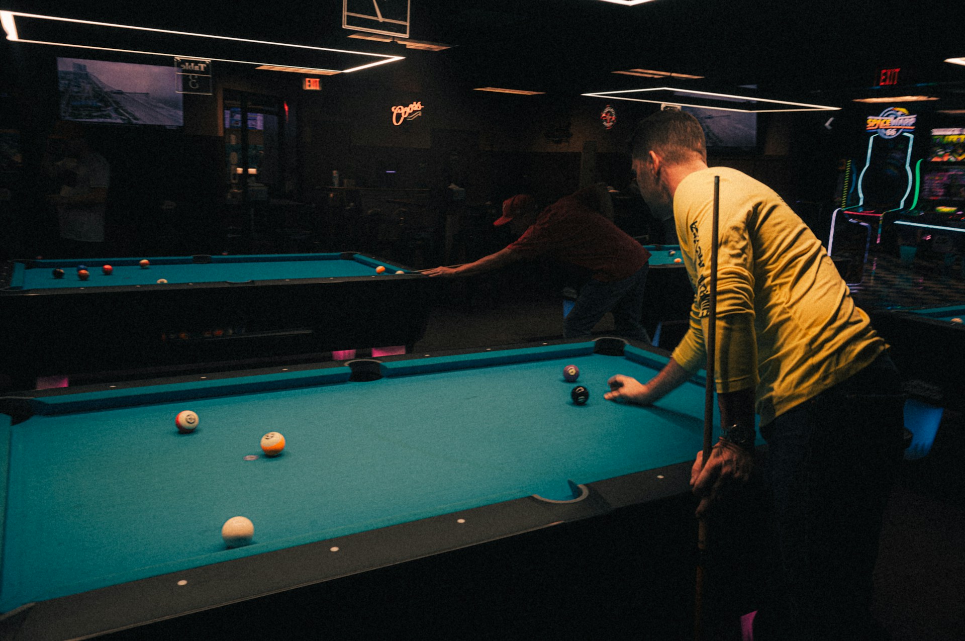 Instructor coaching on the pool table
